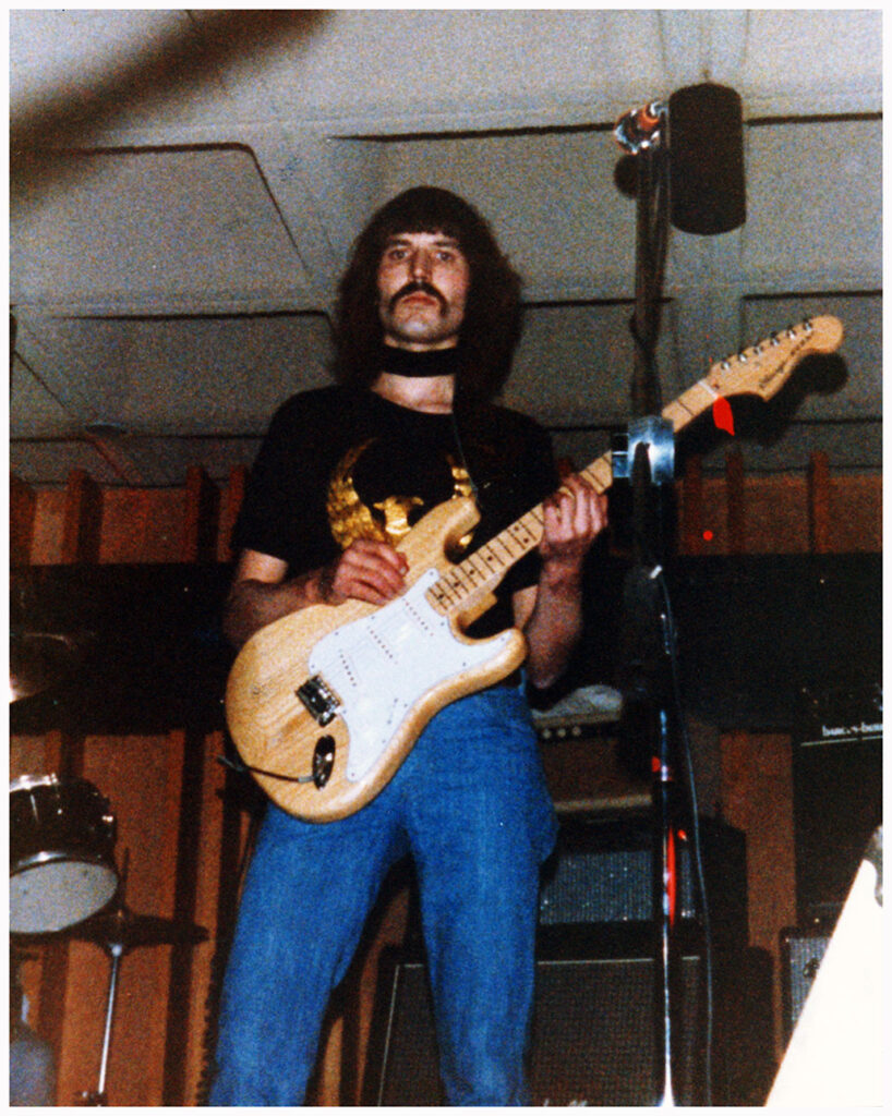 Paul stops to pose for a centerfold during a concert at Mankato State in 1980.